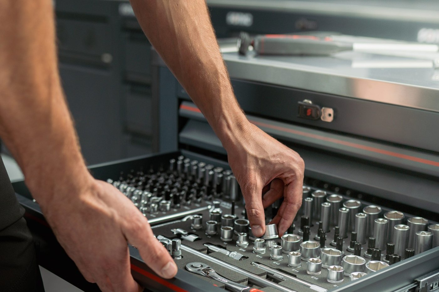 A technician taking a socket from a Sonic Tools shadow-foam drawer